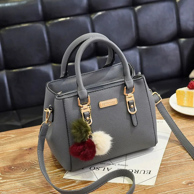 Sac à main à pompon en cuir pour femme